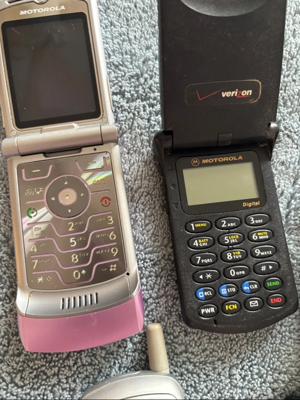Vintage Collection of cell phones includes StarTAC and Pink Flip